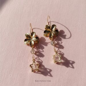RAGNISH luxury gold-toned hoop earrings with sculpted plumeria flower and clear star-cut gemstone drop.
