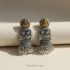 RAGNISH 'Devi' Dual-Tone Jhumkas Oxidized Silver Gold Finish Lakshmi Motif Earrings