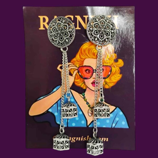 Detailed view of a handmade RAGNISH earcuff with delicate chain and etched silver tassels, perfect for special occasions.