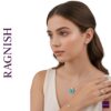Close-up of RAGNISH Enchanted Flight Set: Silver-tone necklace with a bright enamel butterfly charm and matching ring, earrings, and cuff bracelet.