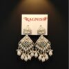RAGNISH luxury pearl and kundan dangler earrings on white card against black background.