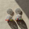 Detailed image of RAGNISH luxury silver-tone jhumkas with bright rainbow beads.