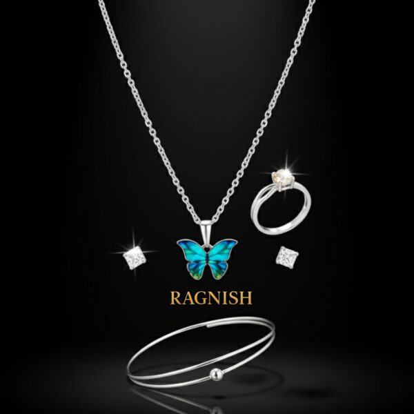 RAGNISH luxury jewelry set with iridescent blue and green butterfly pendant necklace, silver solitaire ring, open bangle, and square stud earrings on a black background.