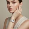 Women's statement jewelry watch, open-cuff design with brilliant diamond simulant stones.