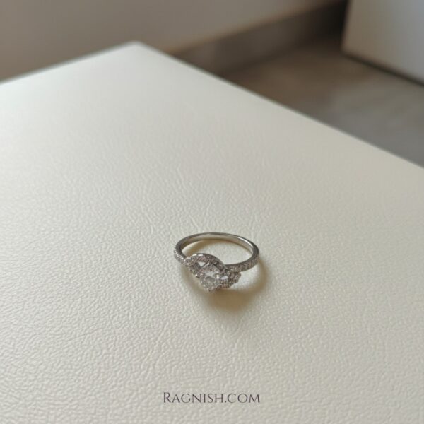 Close-up of RAGNISH Entwined Brilliance Ring with adjustable teardrop zirconia.