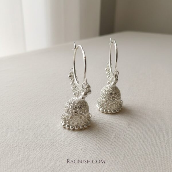 Luxury sterling silver Jhumka earrings for women by RAGNISH, handcrafted traditional jewelry design.