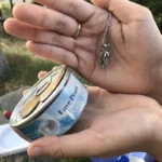 woman holding pearl cage necklace elegant jewelry