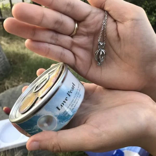 woman holding pearl cage necklace elegant jewelry